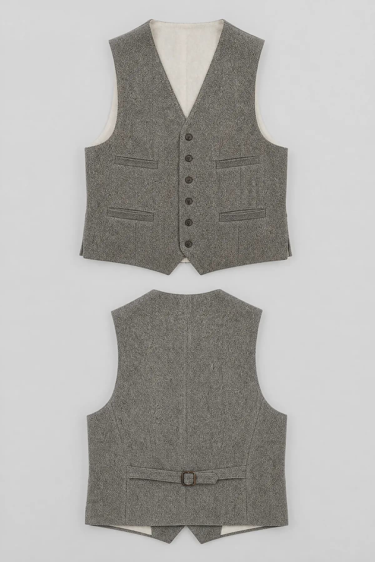 A wool waistcoat laid flat with six buttons, four welt pockets and a buckled back.