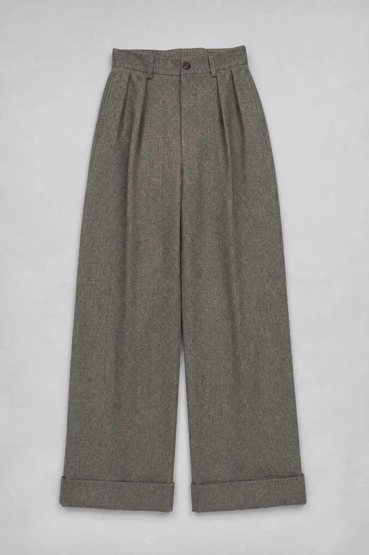 High-waisted wool trousers laid flat with wide straight legs, pleats and deep turn-ups.